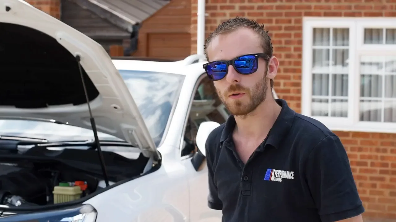Adam Kirkland at a customer's home, bonnet up on the driveway